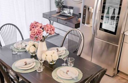 Old East Dallas Condo | Sophisticated 2-bed, 1.5-bath furnished condo in central Dallas featuring a private patio, tranquil garden views, and exclusive access to an award-winning courtyard with spa-inspired wellness amenities, relaxing lounge areas, and resort-style pool.