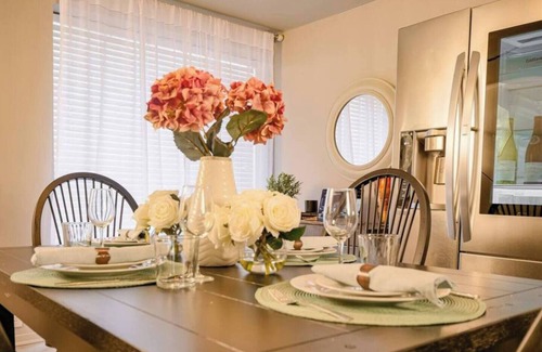 Old East Dallas Condo | Sophisticated 2-bed, 1.5-bath furnished condo in central Dallas featuring a private patio, tranquil garden views, and exclusive access to an award-winning courtyard with spa-inspired wellness amenities, relaxing lounge areas, and resort-style pool.