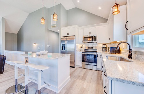 Avon House | Soundside Dog Friendly Home w/Hot Tub, Game Room, Tiki Bar, Screened Porch