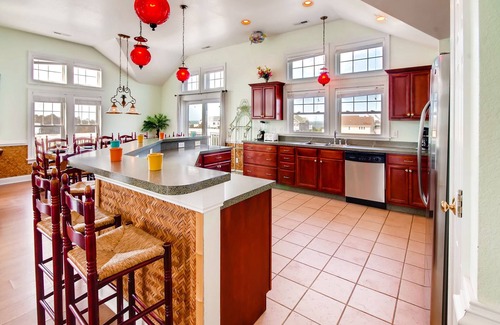 Wind Over Waves House | Soundside Home w/Pool, Hot Tub, Elevator, Game Room, Tiki Bar, and Much More!