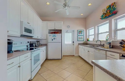 Surf Side Shores House | Spacious 5-bedroom, beach-front family home with wrap-around deck in Ft Morgan