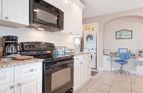 Upper Grand Lagoon Condo | Spacious family condo with large balcony & shared pool and hot tub