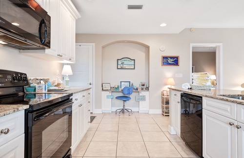 Upper Grand Lagoon Condo | Spacious family condo with large balcony & shared pool and hot tub
