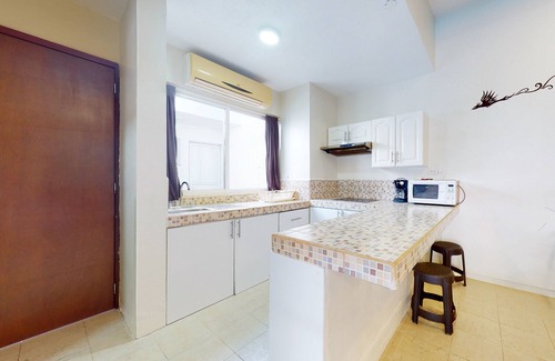 Majahual House | Spanish-style home with pool, W/D, 2 living areas & 2 kitchenettes - near beach