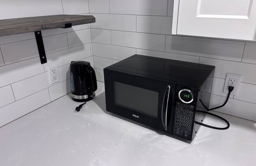 Kitchener Apartment | Specious 3 bedroom house near all amenities + WiFi, modern kitchen, and clean