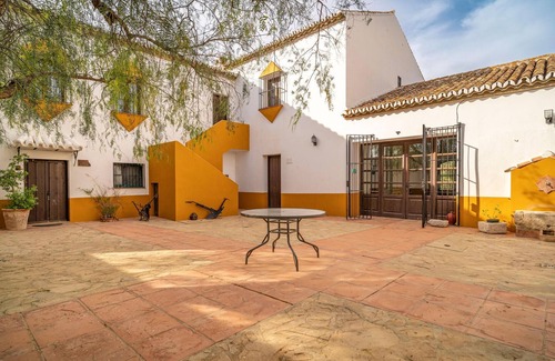 Teba House | Spend a relaxing vacation in this idyllically located vacation home with pool access.