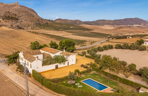 Teba House | Spend a relaxing vacation in this idyllically located vacation home with pool access.