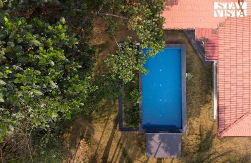 Mananthavady Villa | StayVista at Palm Tree Homes with Complimentary Breakfast, BBQ Grill and Pet-Friendly Home