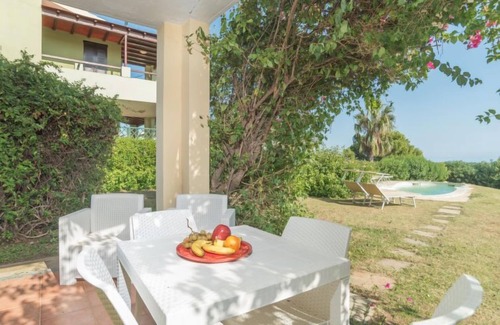 Costa Rei Apartment | Stella con piscina comune (REI100) by Interhome