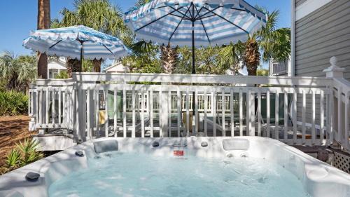 Crystal Shores House | Steps to Beach Arcade Game Room Pool Hot Tub Calico Scallop by AvantStay