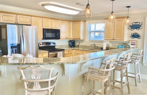 Crystal Beach Condo | STEPS TO THE BEACH! 1st floor end unit with amazing views!