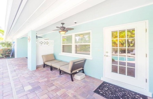 Holmes Beach Villa | Steps to the Beach with Shared Heated Salt Pool and Private Backyard & Grill