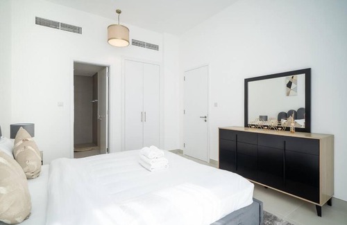 Dubai Investment Park Apartment | StoneTree - Furnished 2BR with floor-to-ceiling window