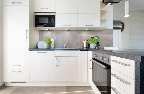 Fehmarnsund Apartment | Strandresidenz Vogelflug App 8