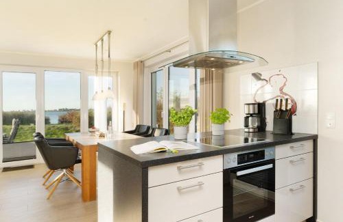 Fehmarnsund Apartment | Strandresidenz Vogelflug App16