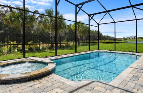 Bay Lake Villa | Striking 9BR Pond view Pool/SPA near Disney World