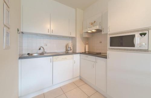 De Haan Apartment | Studio Zeeflat with parking and shared pool by Interhome