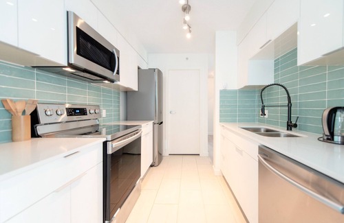 West End Apartment | Stunning 2-Bedroom Downtown Apartment with Water Views & Gym Access