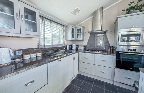 Hunstanton House | Stunning lodge with decking at Manor Park near Hunstanton Beach ref 23066W