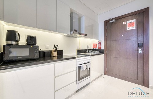 Dubai Apartment | Sunlit Studio At Golf Promenade 2A DAMAC Hills by Deluxe Holiday Homes
