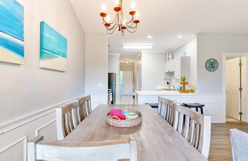 Little River Condo | Sunny condo with pool access, coastal theme, balcony, W/D, and central AC