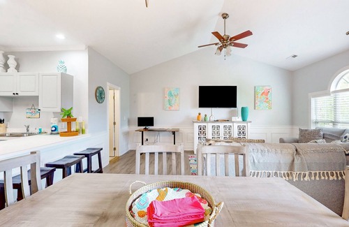 Little River Condo | Sunny condo with pool access, coastal theme, balcony, W/D, and central AC