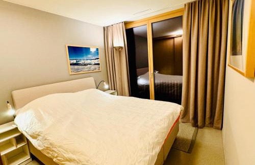 Flims Apartment | Sunny Stenna Selva 3-room ski-in ski-out apartment right by the slopes & lifts