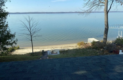 Alden Cottage | Sunsets & Private Sandy Beach Cottage on Torch Lake in Alden