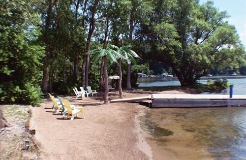 Sodus Point Cottage | (Swan) Caribbean cottage on Sodus Bay' Palm Trees,