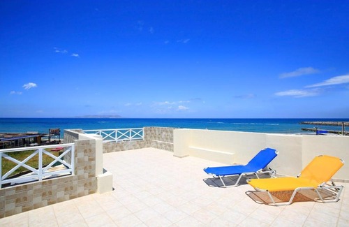 Gouves Apartment | Swim, sunbathe, relax in beach front apt Theodosia