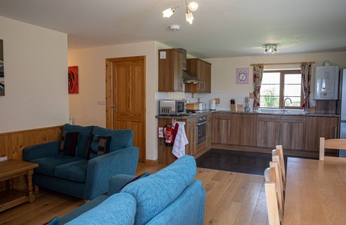 Torrington Cottage | TARKA'S HOLT LOG CABIN, family friendly, with pool in Torrington