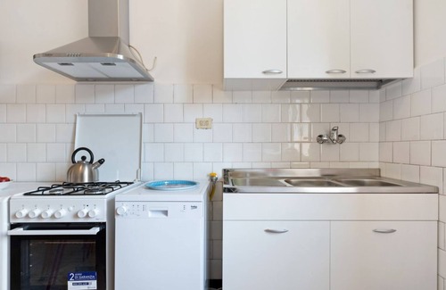 San Donato Apartment | The apartment is located on the fourth floor of a building with a lift, not suitable for the disabled.It comfortably accommodates six people in 102 square meters of space, with a double bed, two single beds and a sofa bed in the living room.Complete with
