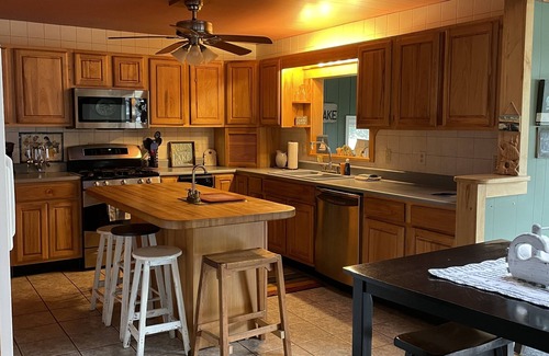 Ludington Cottage | The Bay Cottage has wonderful views of Hamlin lake from its deck 50’ from lake