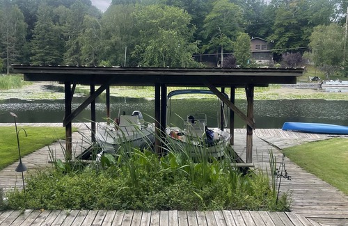 Ludington Cottage | The Bay Cottage has wonderful views of Hamlin lake from its deck 50’ from lake