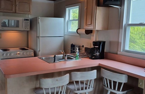 Winchester Cottage | The Cottage at Highland Lake, year-round, waterfront with a boat dock