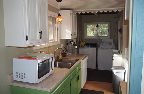 Kalkaska Ski Chalet | The Cub Hill Chalet on Cub Lake - Private Lakefront, Dock, Raft, Water Toys, Huge Deck, and Spa!