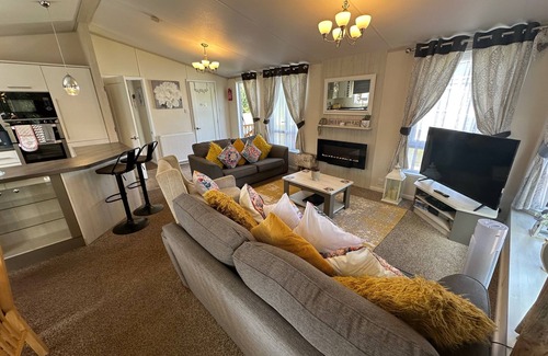 Tattershall Cabin | The Indulgence Lakeside Lodge is prime location with private fishing peg, sunken hot tub on Osprey