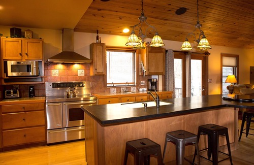 Logan Cabin | The Lodge at Harvest Moon sleeps 16 with five bedrooms and unique private Pub
