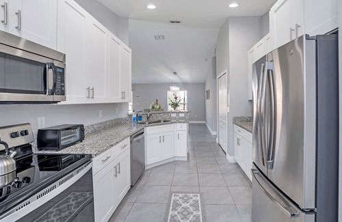 Poinciana House | THE MODERN OASIS - SPACIOUS 4 BDRM VACATION HOME. MINS. FROM DISNEY.