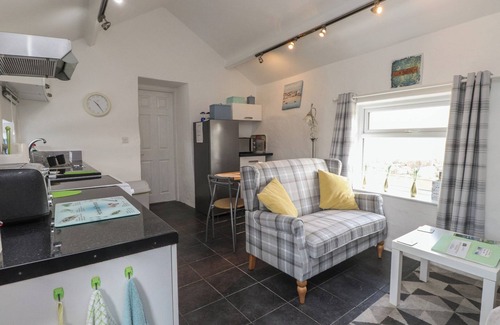 Cemaes Bay Cottage | THE OUTBUILDING AT TYN LLAN, romantic, with a garden in Cemaes Bay