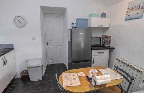 Cemaes Bay Cottage | THE OUTBUILDING AT TYN LLAN, romantic, with a garden in Cemaes Bay