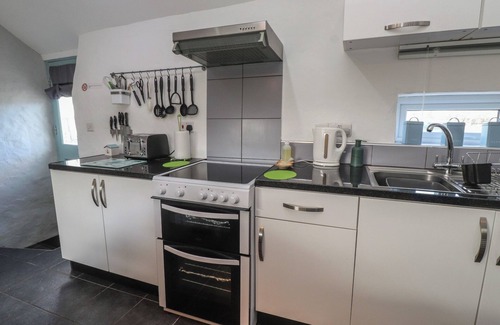 Cemaes Bay Cottage | THE OUTBUILDING AT TYN LLAN, romantic, with a garden in Cemaes Bay