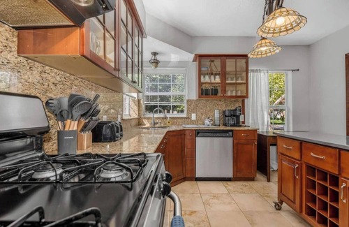 Oak Cliff House | The private home features two master suites with King beds and full attached bathrooms. The loft is 3rd private getaway with a Queen bed and attached full bath. Fully stocked kitchen and a separate Oak dining area.