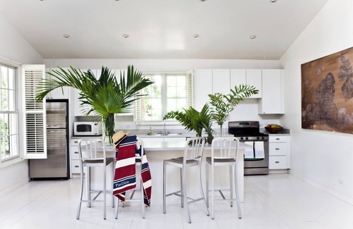 Dunmore Town Cottage | Theatrical retreat set just above Harbour Island's Pink Sand Beach, bold design meets island calm