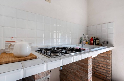 Colorno Apartment | This apartment is located on the top floor of a country villaCharacterized by large spaces including an inviting very bright living room thanks to large windows, a kitchen and a large bedroom accessible via a spiral staircaseAmong the common areas a beau