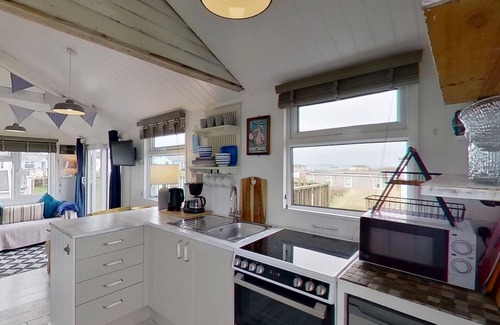 Hayle Apartment | This snug chalet is just a short walk from three miles of sandy surf.