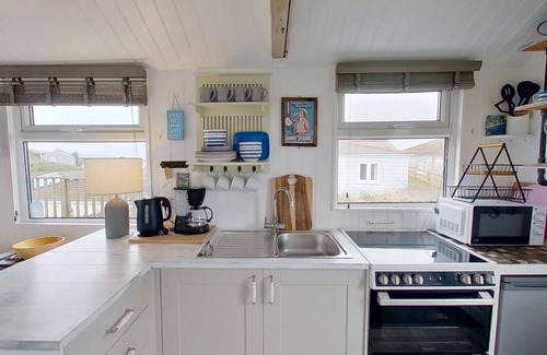 Hayle Apartment | This snug chalet is just a short walk from three miles of sandy surf.