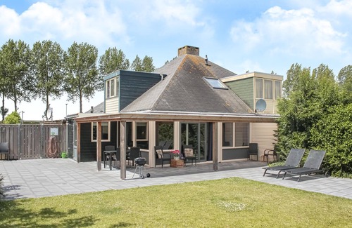 Stavenisse House | This vacation home in Zeeland is in a beautiful location near the water.