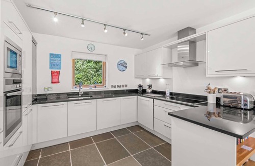 Talland House | This wonderfully light open-design, pet friendly house overlooks the charming natural pool and is cl