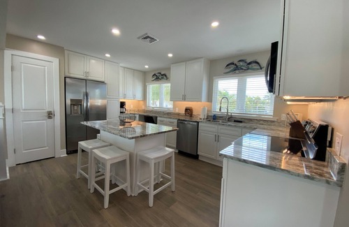 Fort Myers Beach House | Times Square Gem! 4BR Canal front home, private Pool/Spa, Sleeps 12
